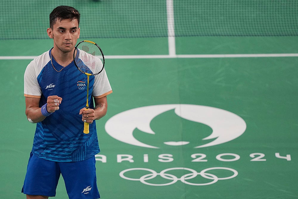 | Photo: AP/Kin Cheung : Lakshya Sen celebrates after defeating Jonatan Christie 
